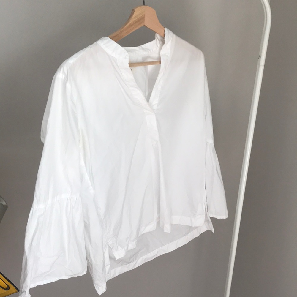 White bell sleeved blouse